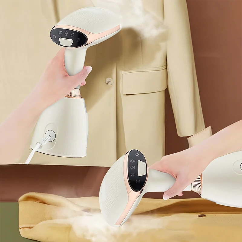 Handheld white and rose gold garment steamer emitting steam while pressing a beige blazer