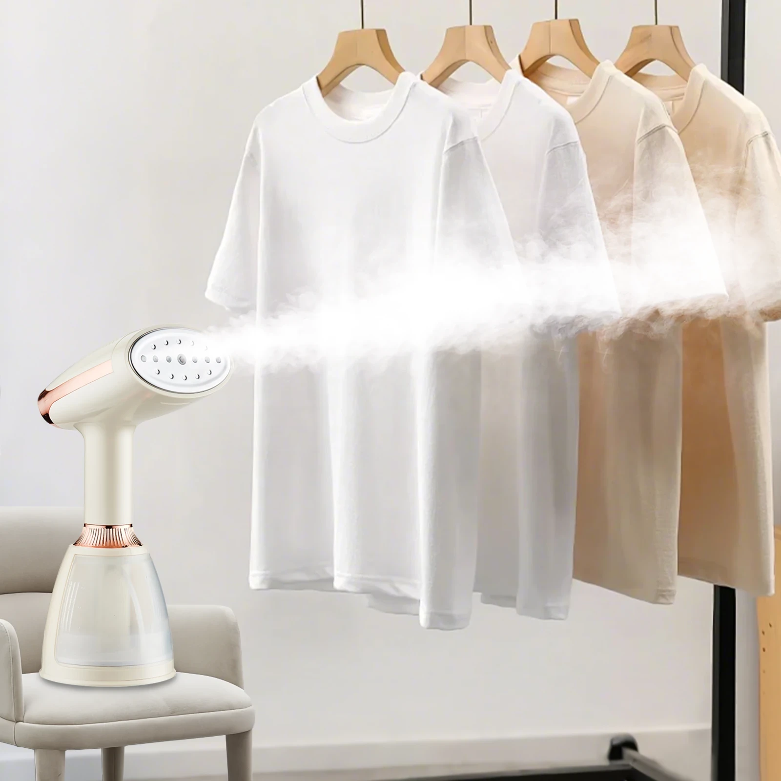 White handheld garment steamer with rose gold accents steaming white T-shirts on wooden hangers