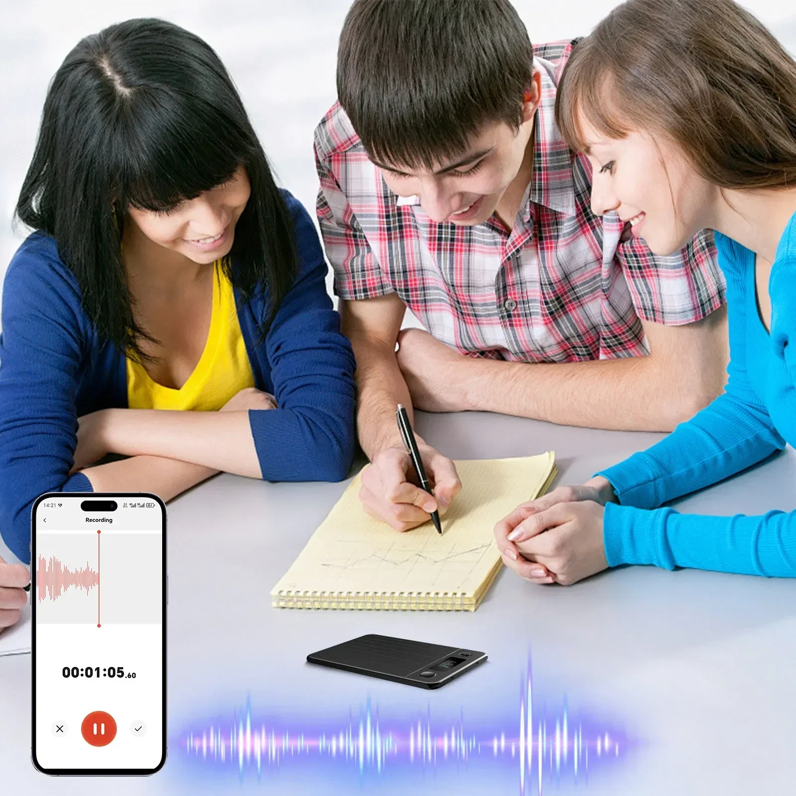 Three students writing in a spiral notebook beside a phone voice-recorder screen and a small black recorder with audio wavefo