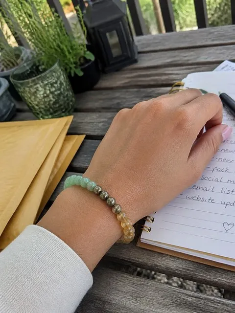 Small-business owner wearing the bracelet while planning outdoors