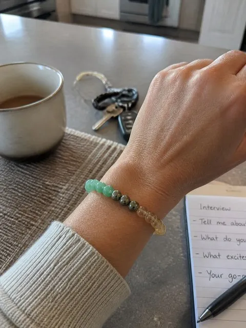 Money Success crystal bracelet in a casual kitchen before an interview
