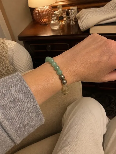 Money Success bracelet on a lived-in evening dresser