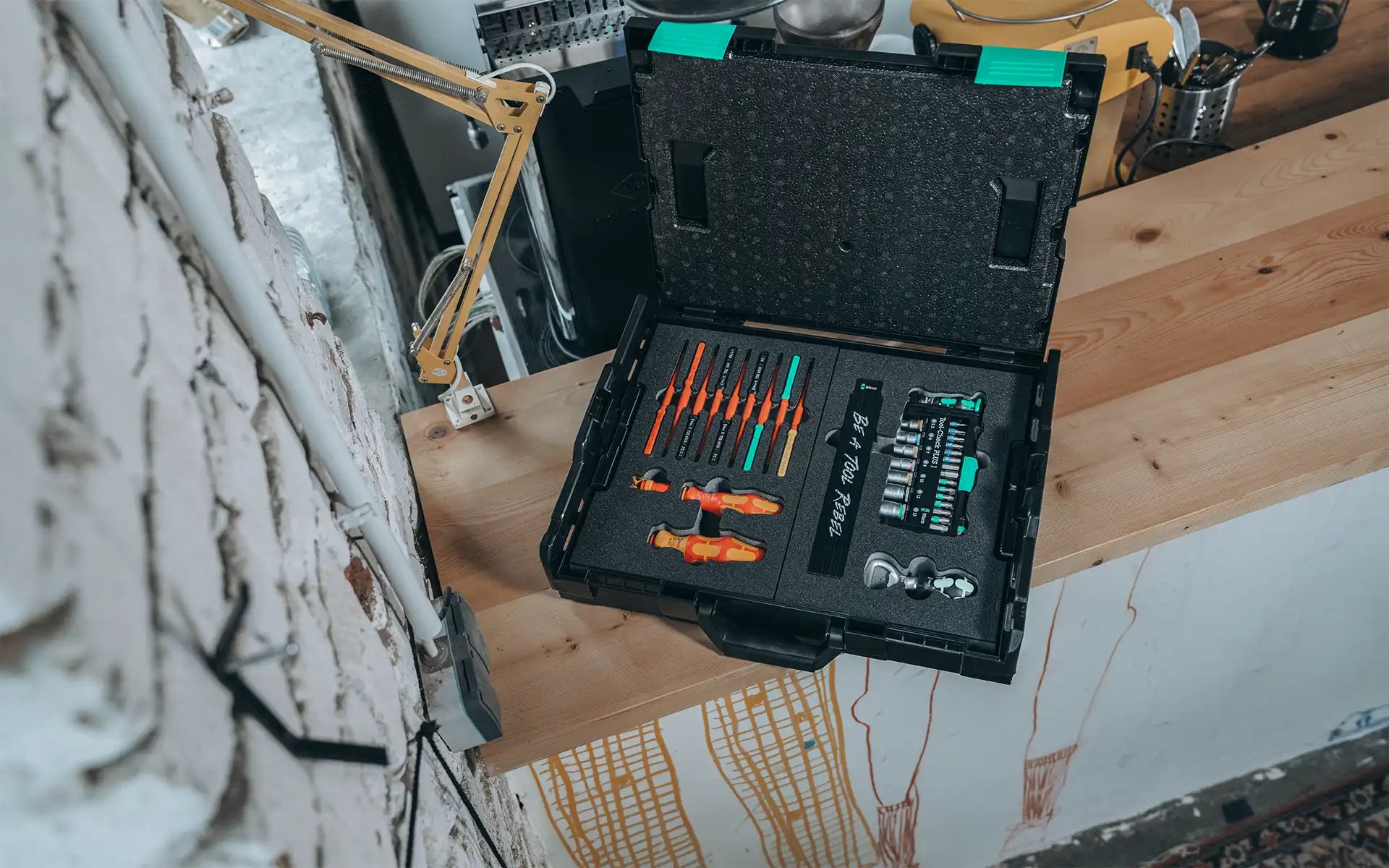 Organized workshop tool case on a workbench