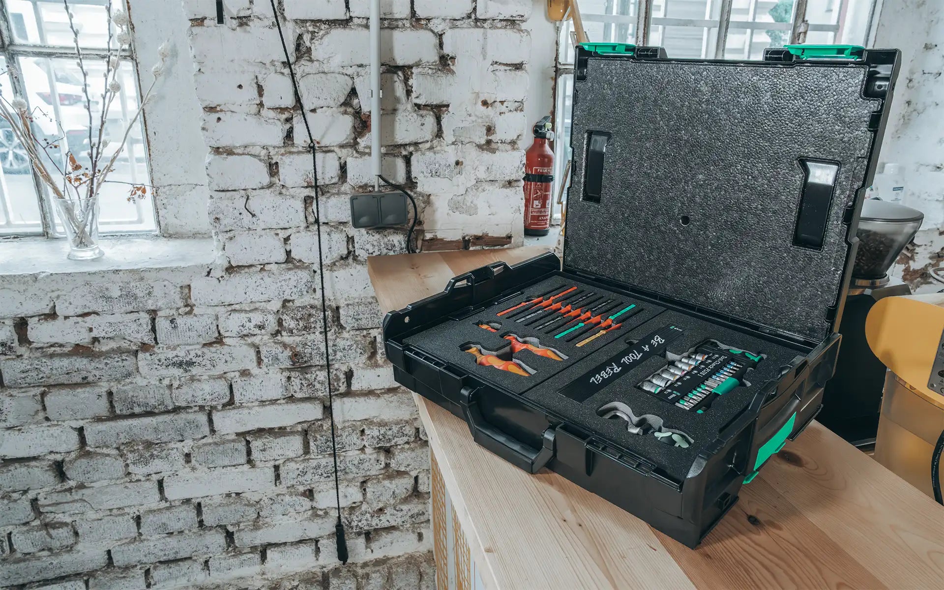 Open tool case with accessories stored in foam inserts