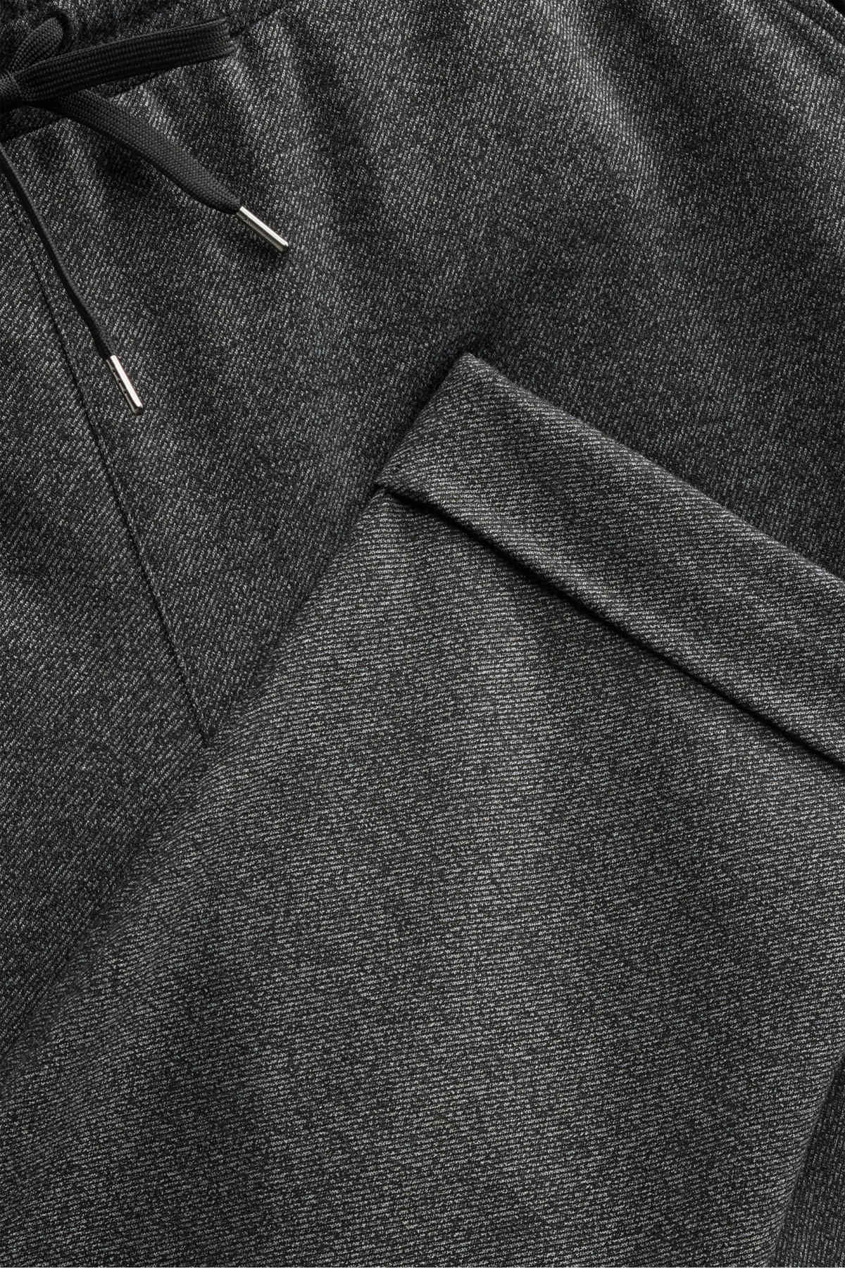 Jersey trousers - mid-rise waist - tapered fit - dark gray