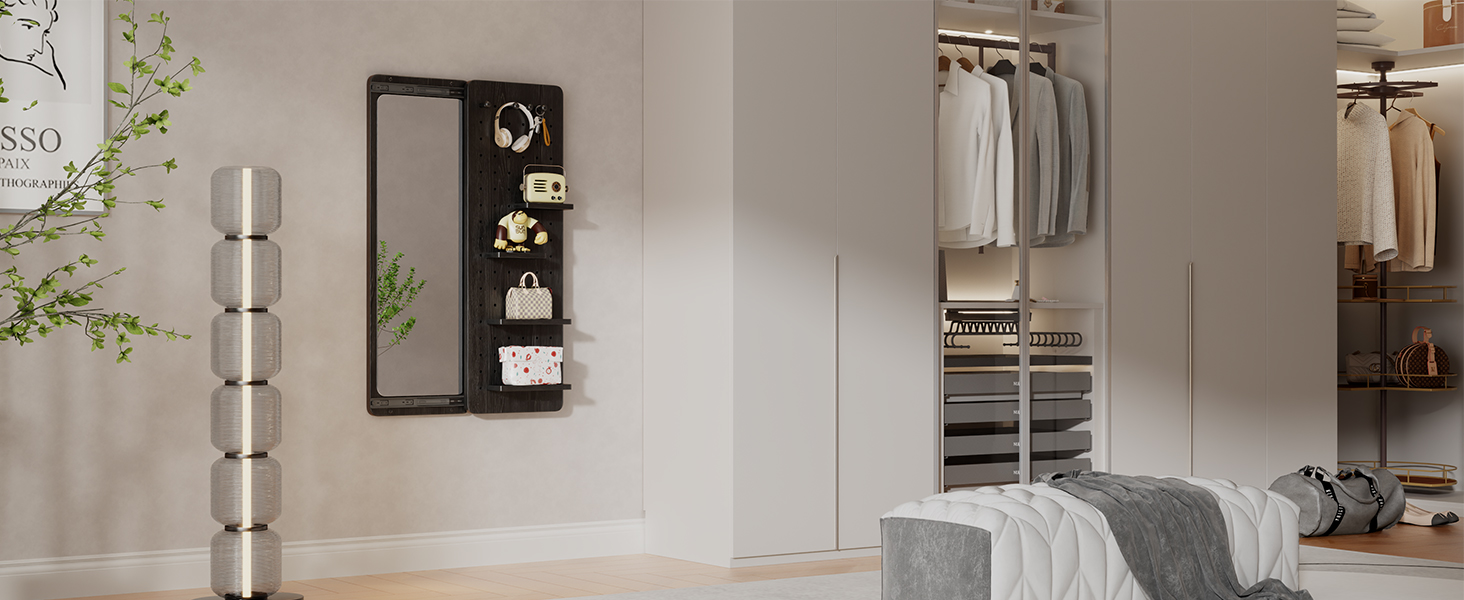 A wall mirror in the walk-in closet enhances the room