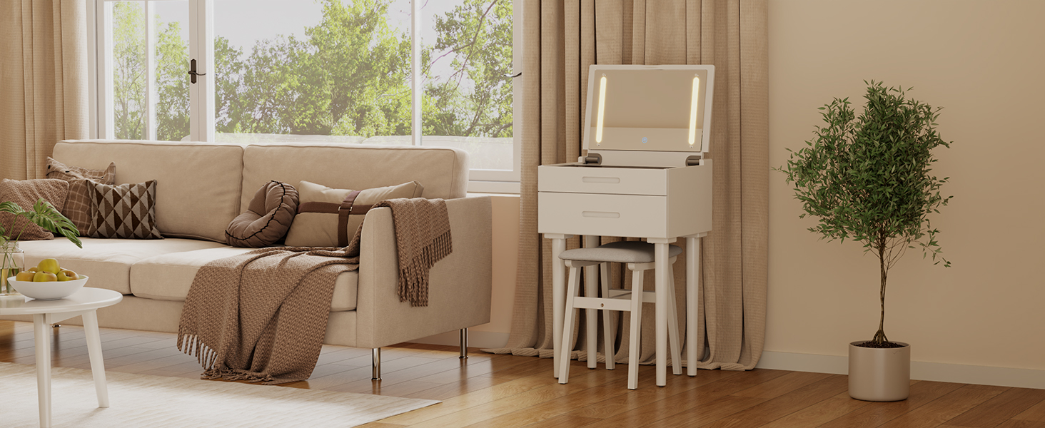 living room vanity desk set near sofa with pillows blanket potted plant right framed artwork on wall