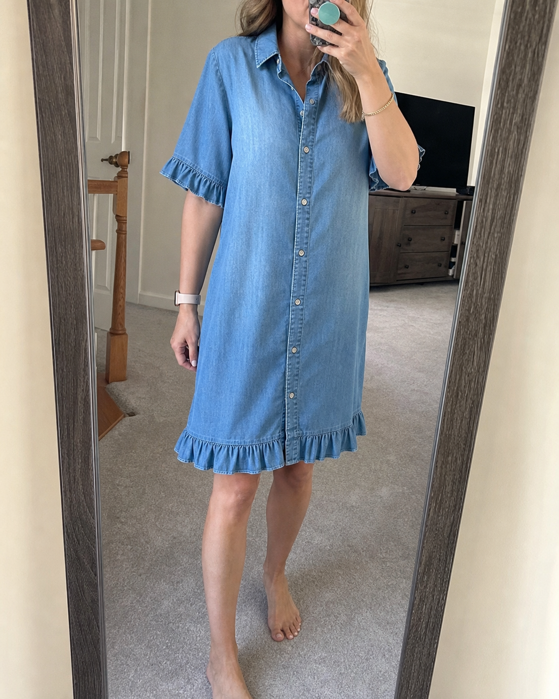 Customer wearing the denim shirt dress in a mirror outfit photo