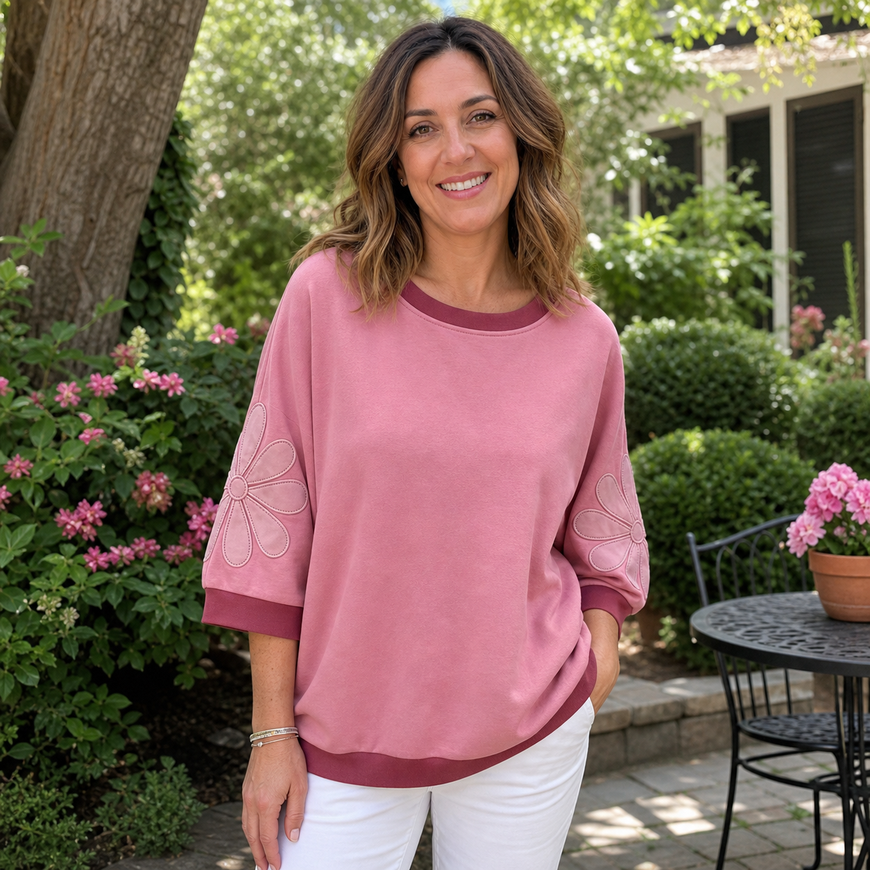 Customer review photo in the pink floral applique top