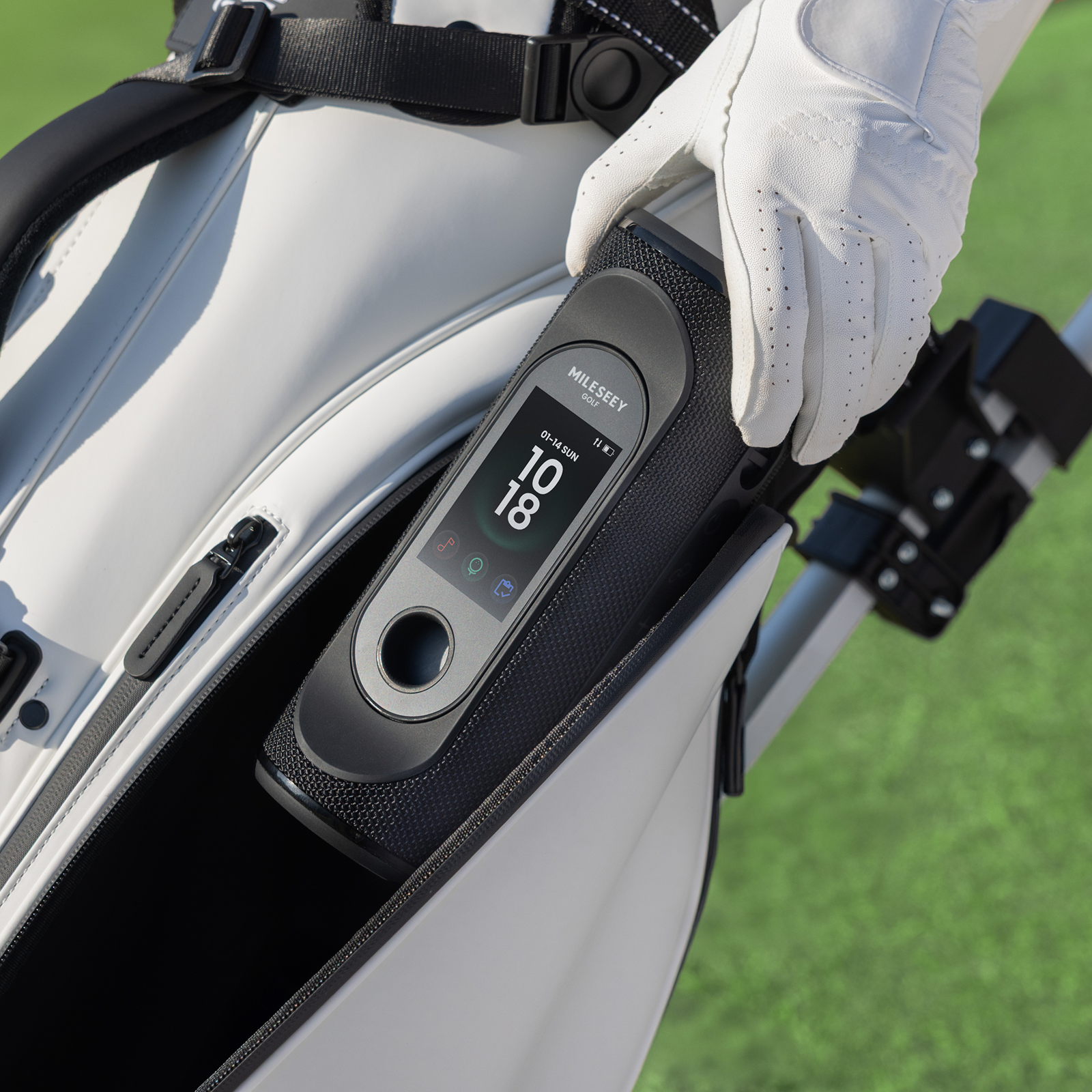 The MILESEEY GeneSonic Pro Detachable GPS Speaker is being placed into a Golf Bag