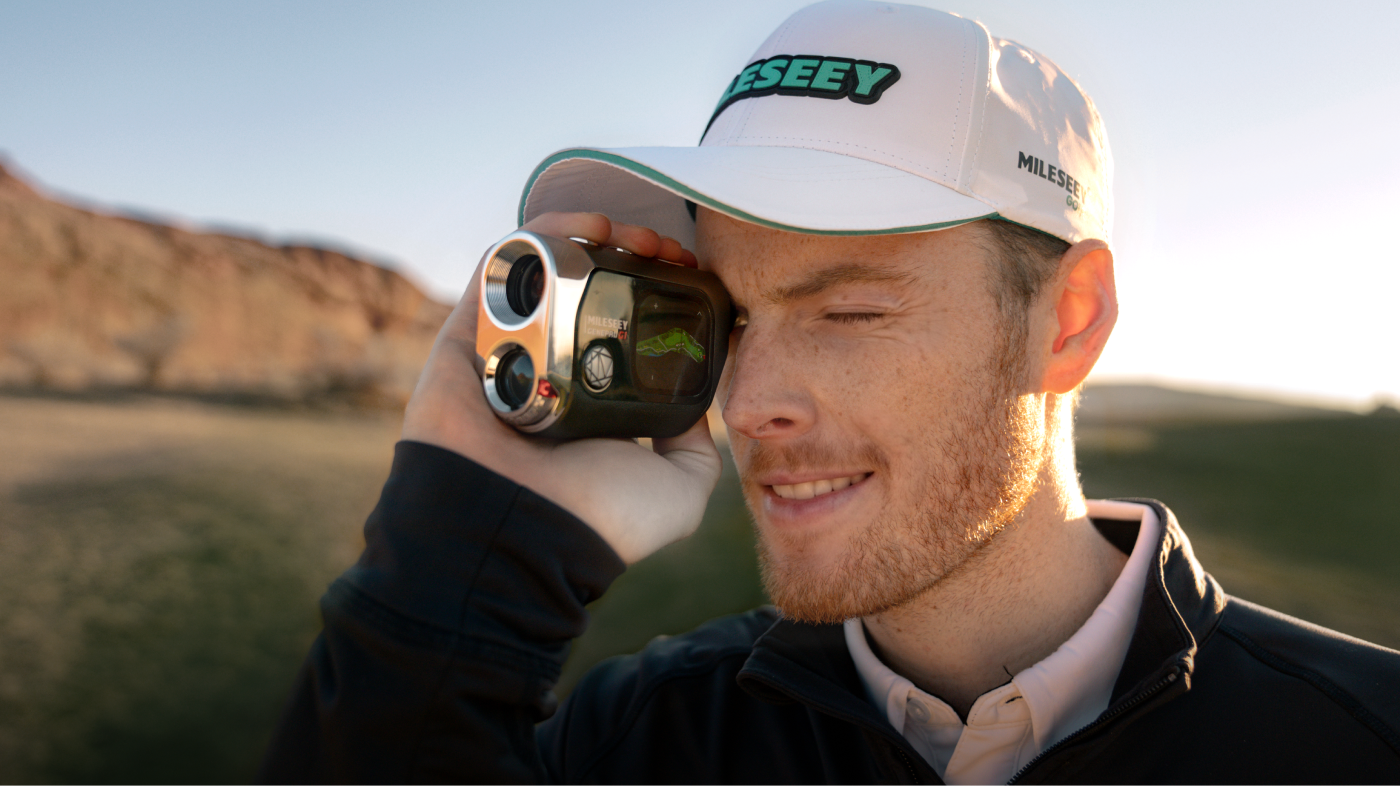 A Young Golfer Measuring Yardage with Mileseey Golf Rangefinder