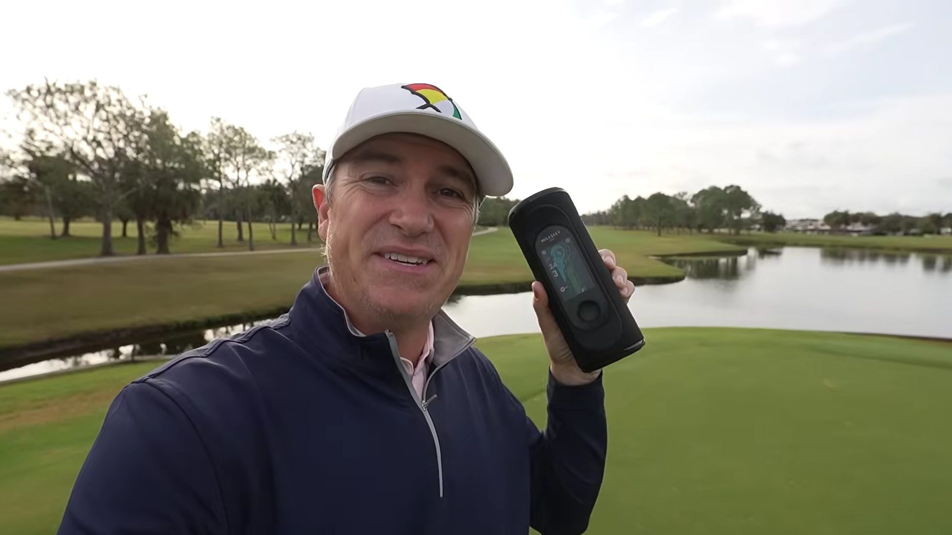 The Influencer Lets Play Thru Holding a GeneSonic Pro Golf Speaker
