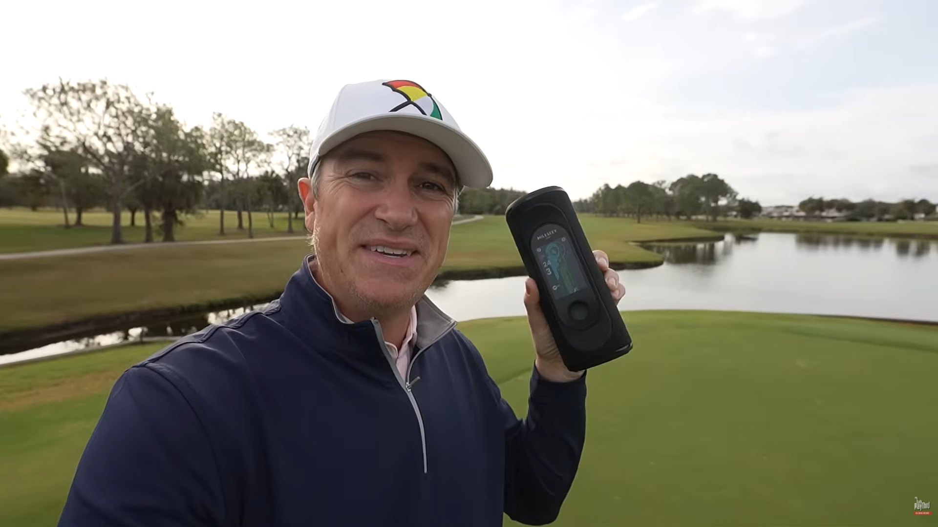 A Cheerful Man Presenting the Unique Golf Speaker at a Golf Course