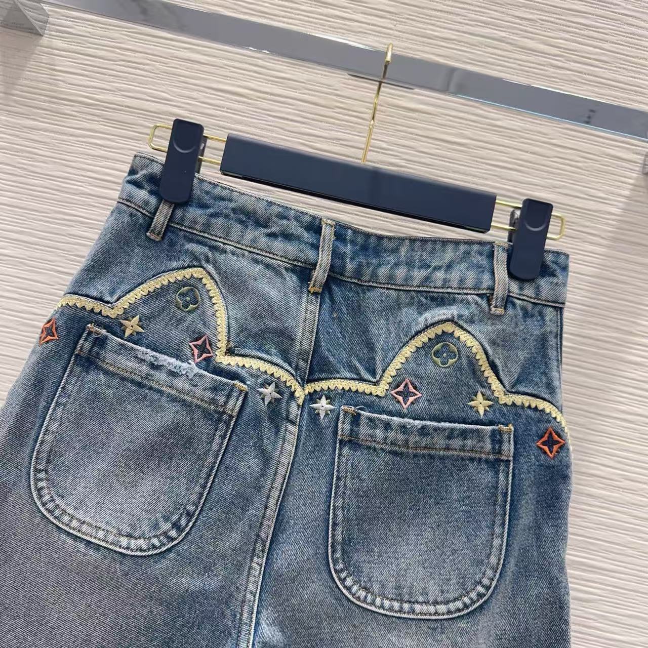 LU Vintage-Wash Embroidered Denim Hot Pants.