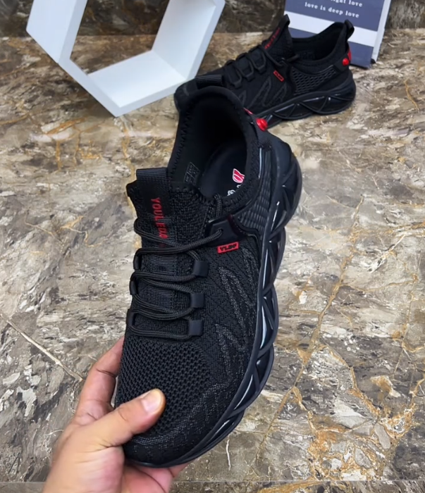 Hollow Mesh Athletic Sneaker with Geometric Blade Sole and Adjustable Strap for Futuristic Sport Style