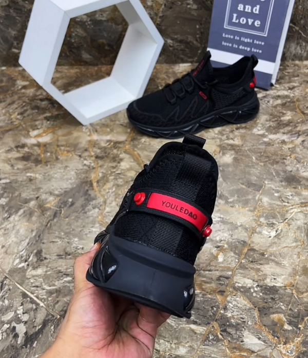 Hollow Mesh Athletic Sneaker with Geometric Blade Sole and Adjustable Strap for Futuristic Sport Style