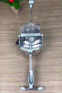 Manual fruit juicer compact kitchen tool demonstration