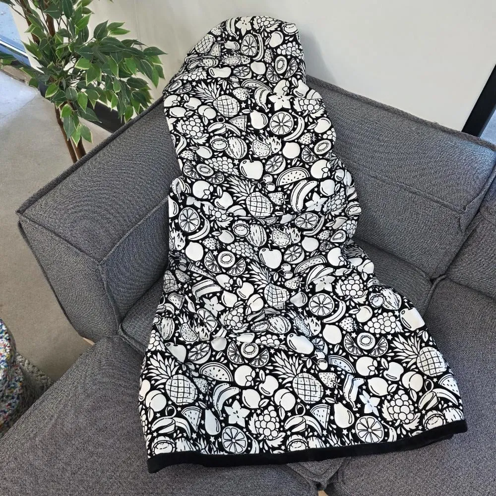 Juicy Fruits blanket on a sofa