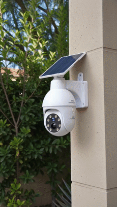 Solar powered simulated surveillance camera street light