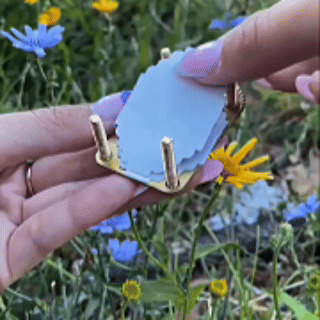 Tightening the miniature brass flower press