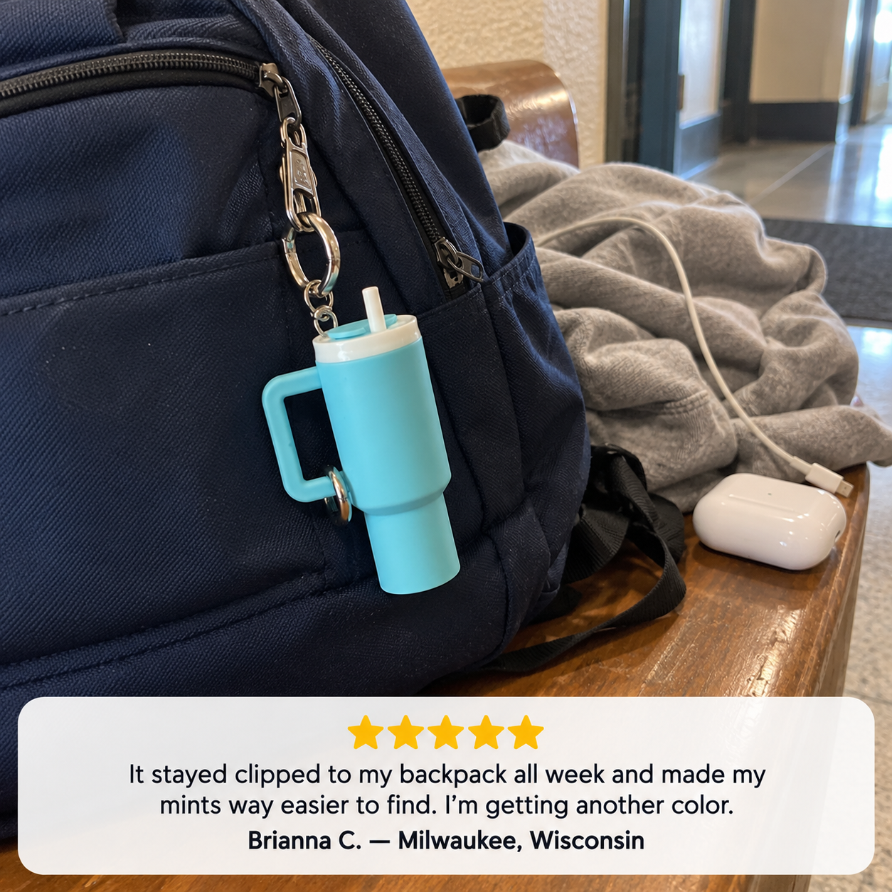 Customer review of a mini storage cup clipped to a backpack