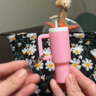 Opening and using the mini cup keychain storage container