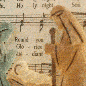 Close-up of translucent sea-glass Nativity figures
