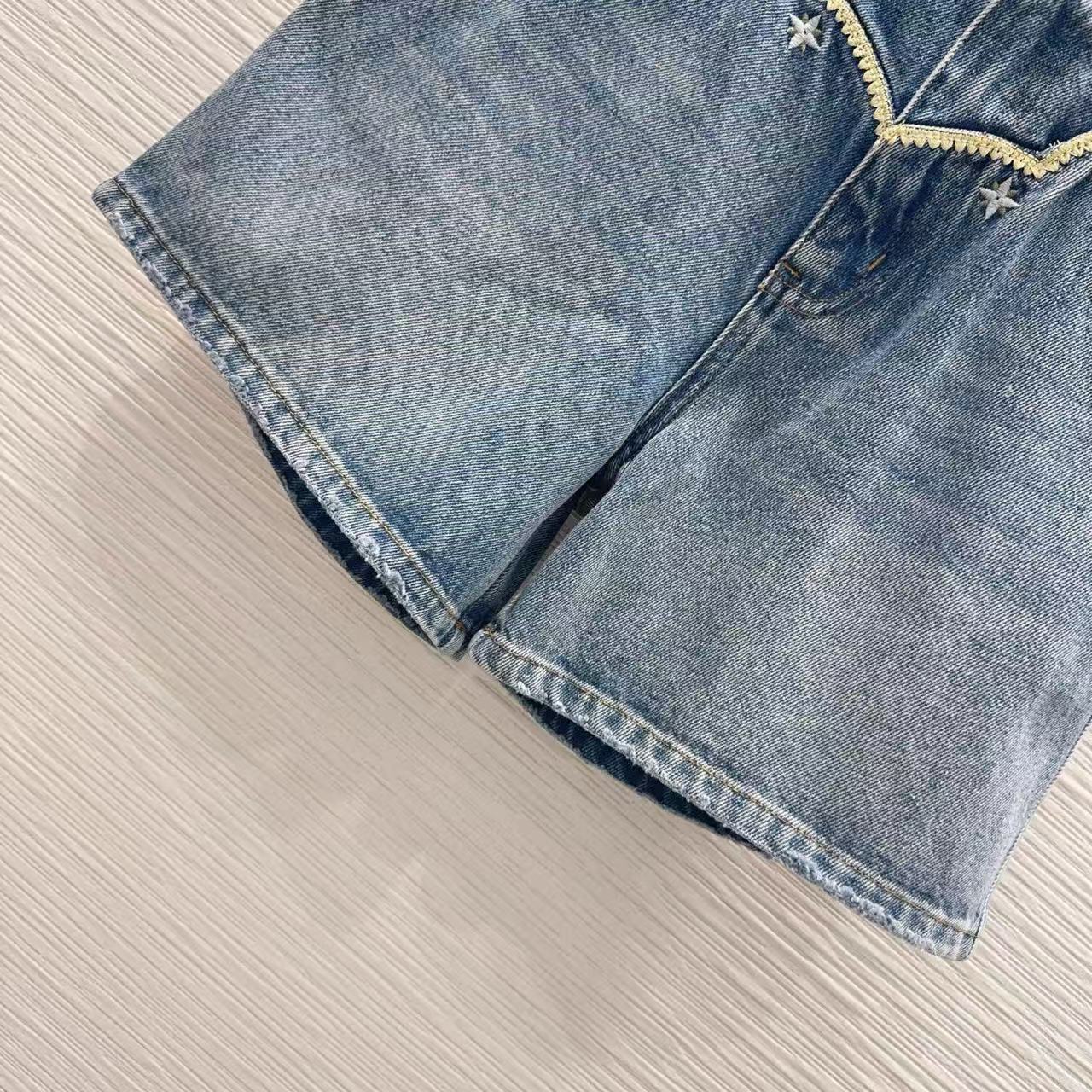 LU Vintage-Wash Embroidered Denim Hot Pants.
