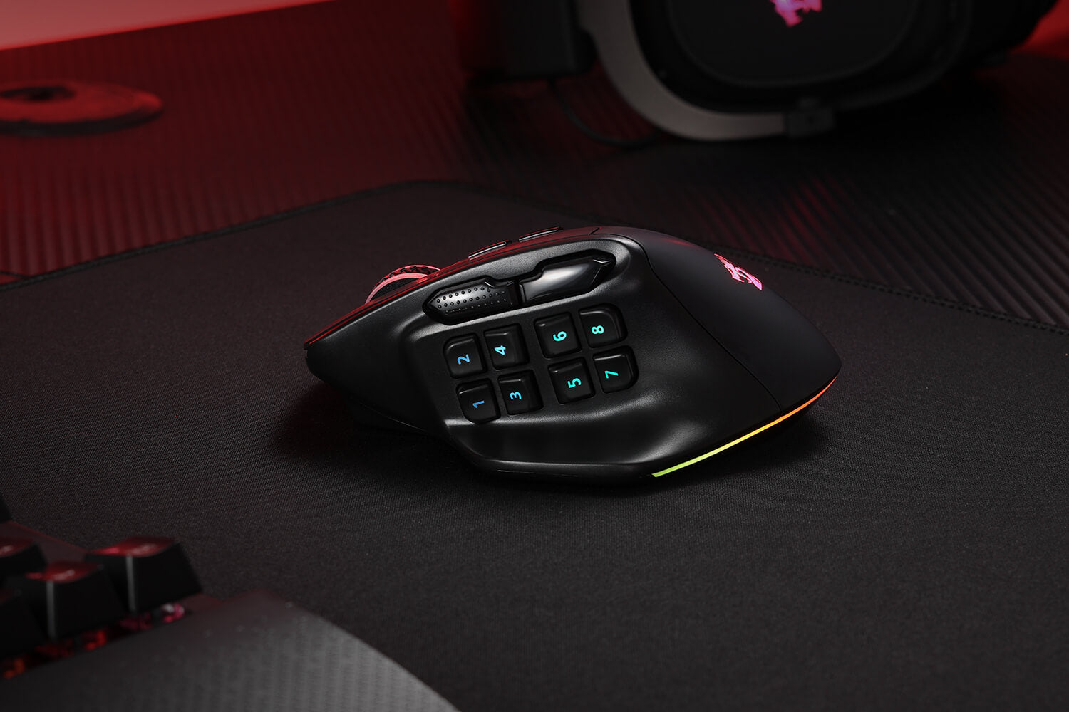 Side view of the AATROX M811 PRO mouse on a black mouse pad, highlighting the 12 programmable side buttons.