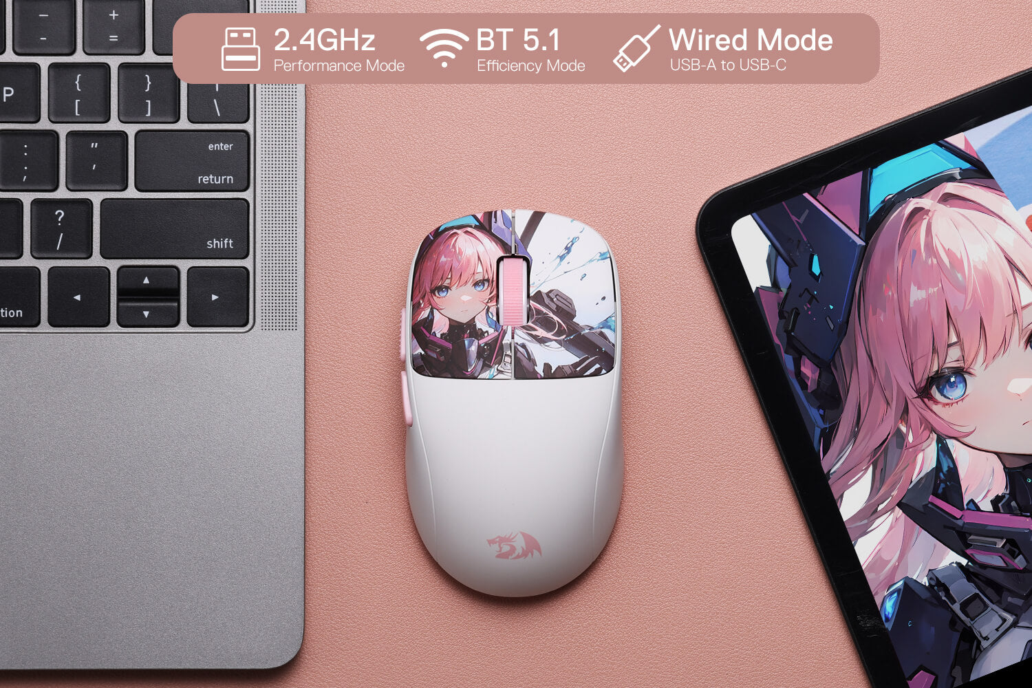 Mouse with anime design next to a laptop and tablet on a pink surface