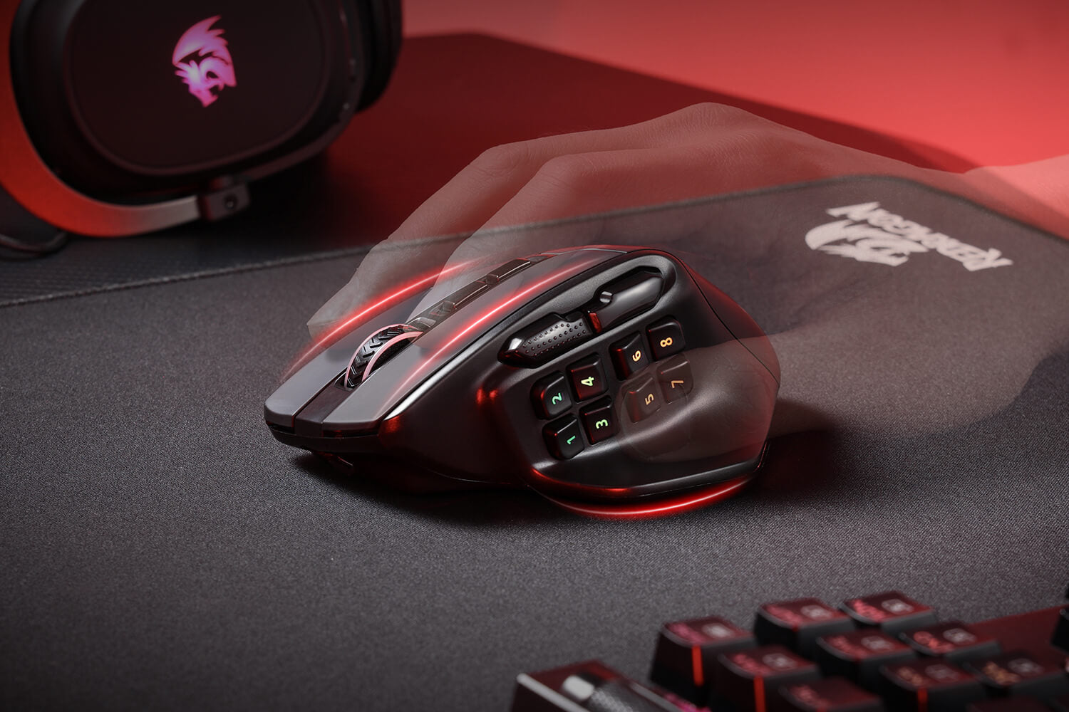 Hand hovering over the AATROX M811 PRO mouse on a black mouse pad, emphasizing the ergonomic design and precision.