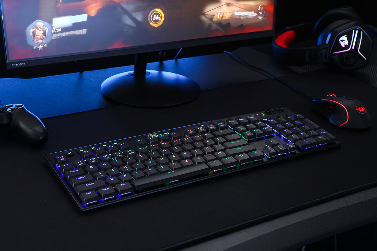 Redragon K618 wireless mechanical keyboard on a gaming desk setup, illuminated with vibrant RGB backlighting.
