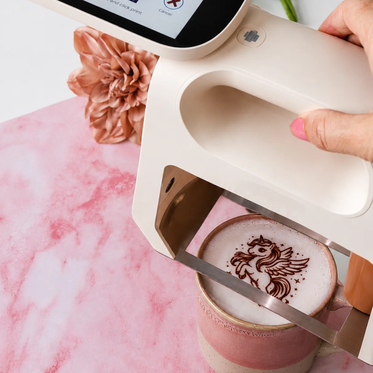 Portable food printer printing a decorative design on a drink