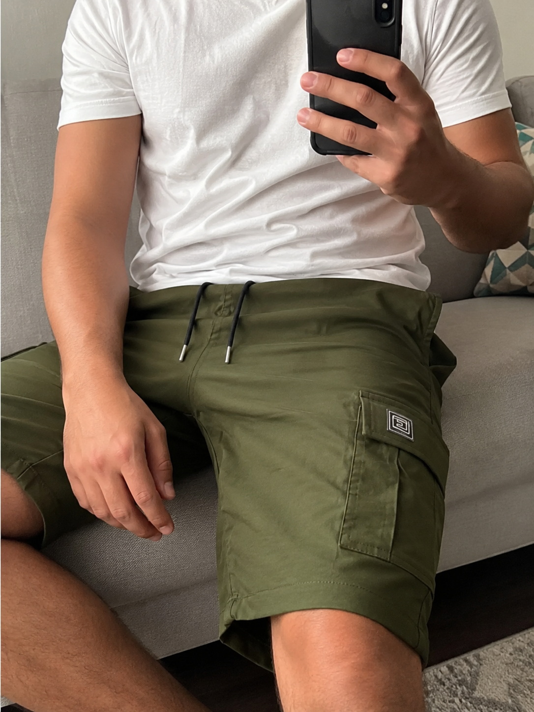 Elastic Waist Drawstring Cargo Shorts Green seated buyer fit photo buyer-style fit reference