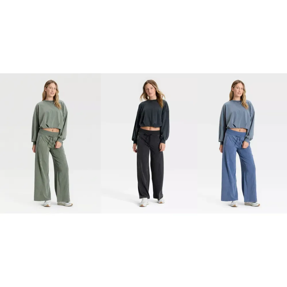 Three matching outfits in green, black and blue