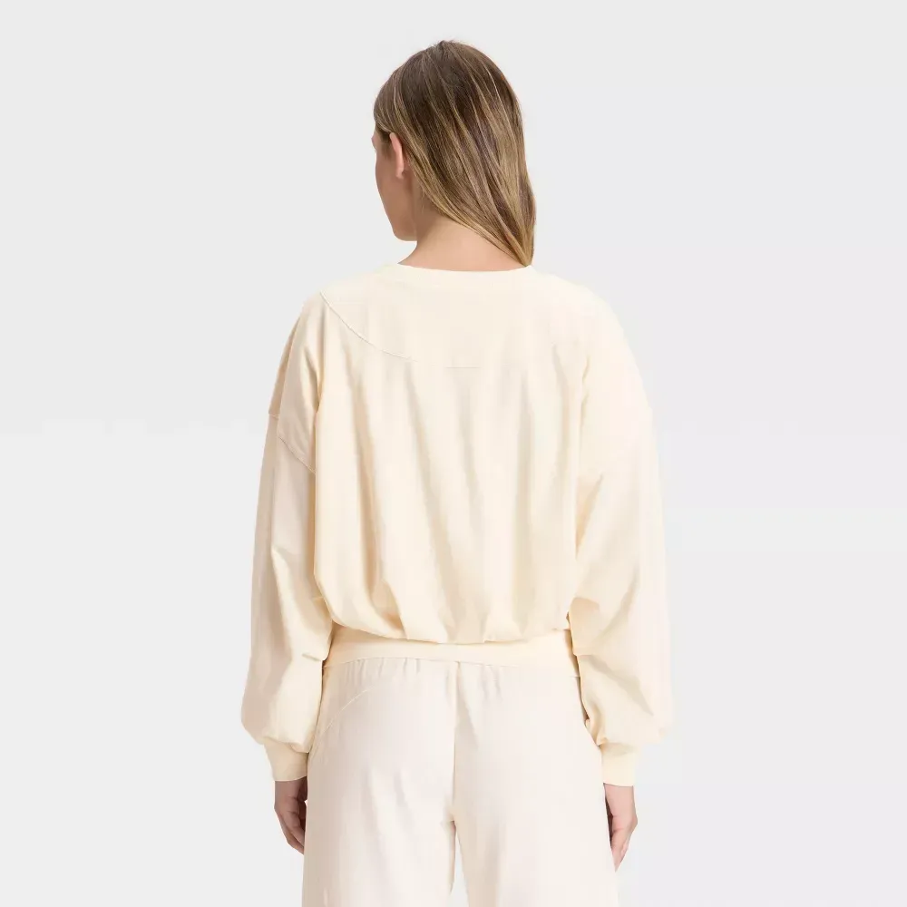 Cream bubble-hem long sleeve top, back view