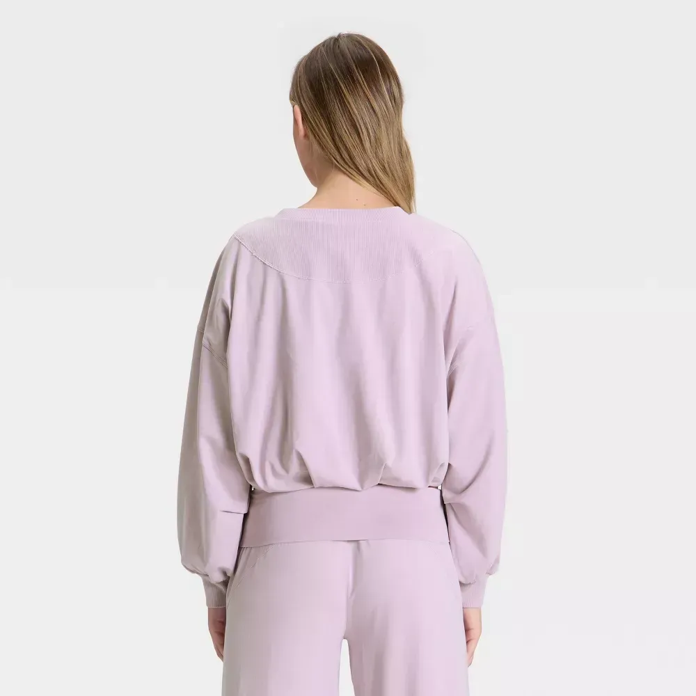 Lavender bubble-hem long sleeve top, back view