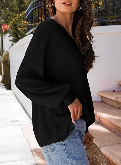 Black waffle knit top styled with jeans