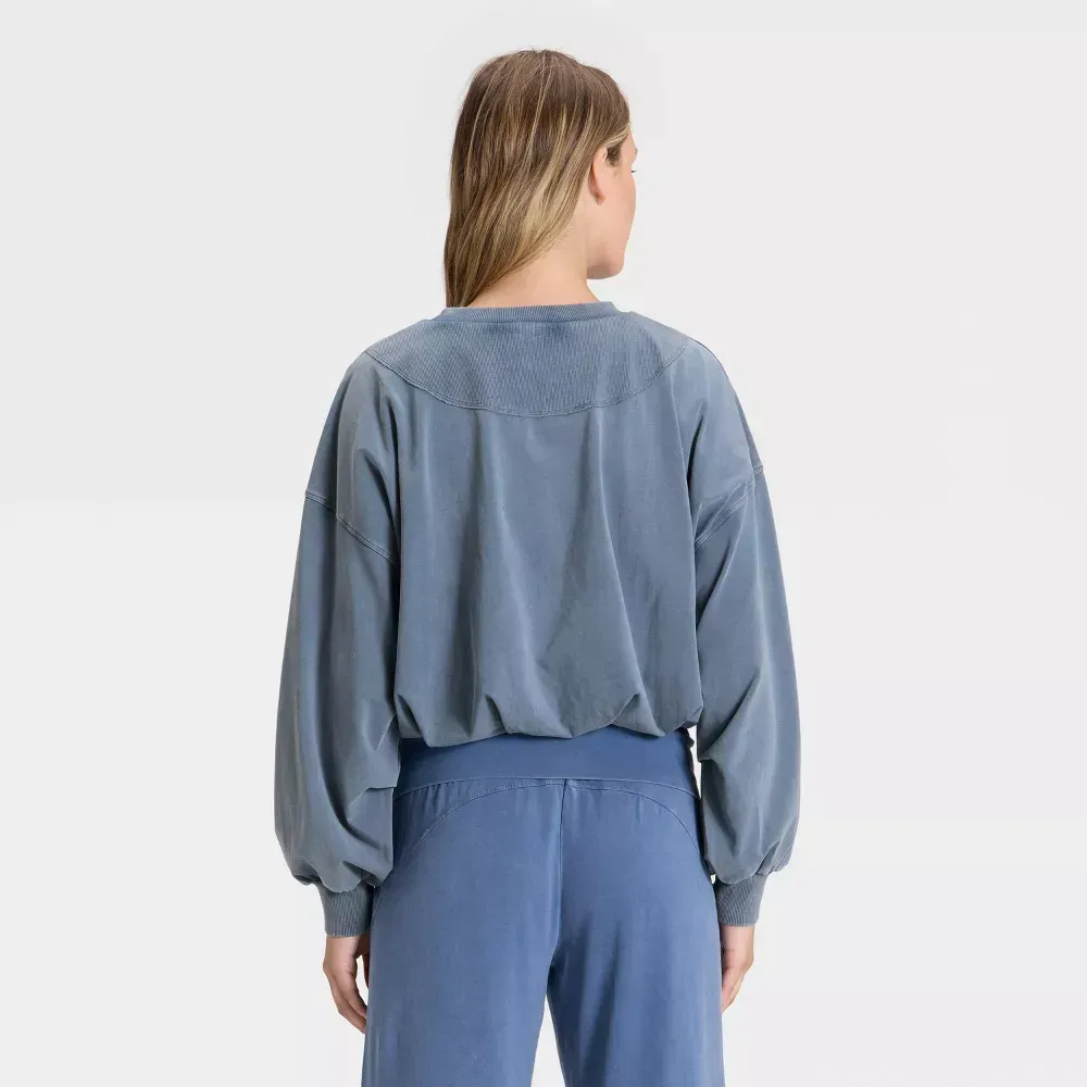 Blue bubble-hem long sleeve top, back view