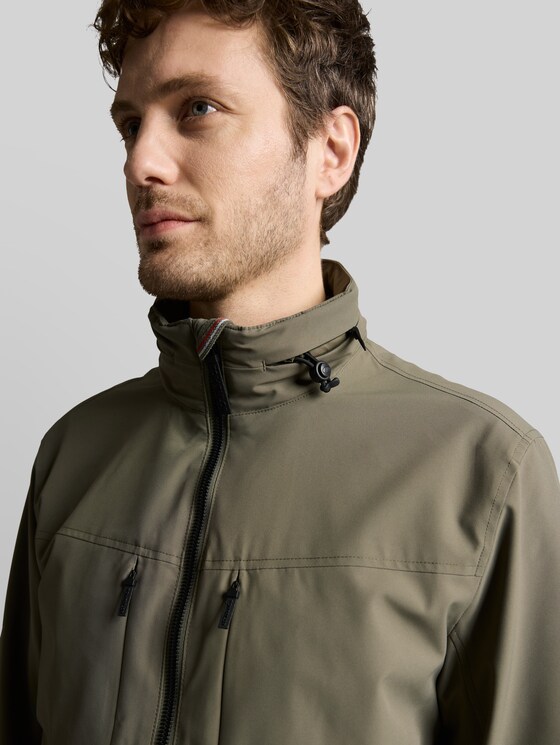 Blouson jacket with stow-away hood - faded leaf green