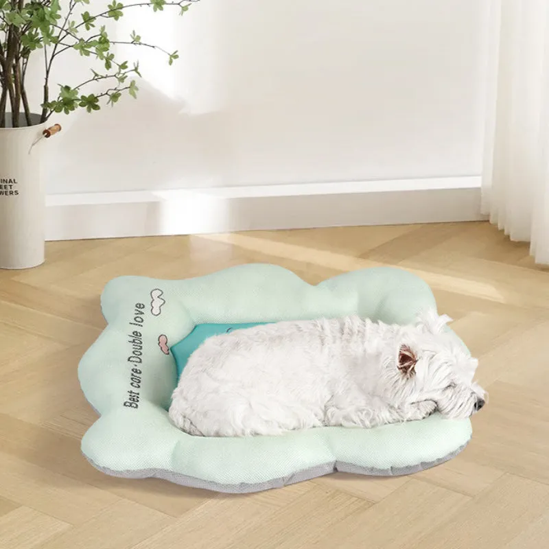 Green and pink pet cooling mats for dogs and cats in four different sizes on a wooden floor.