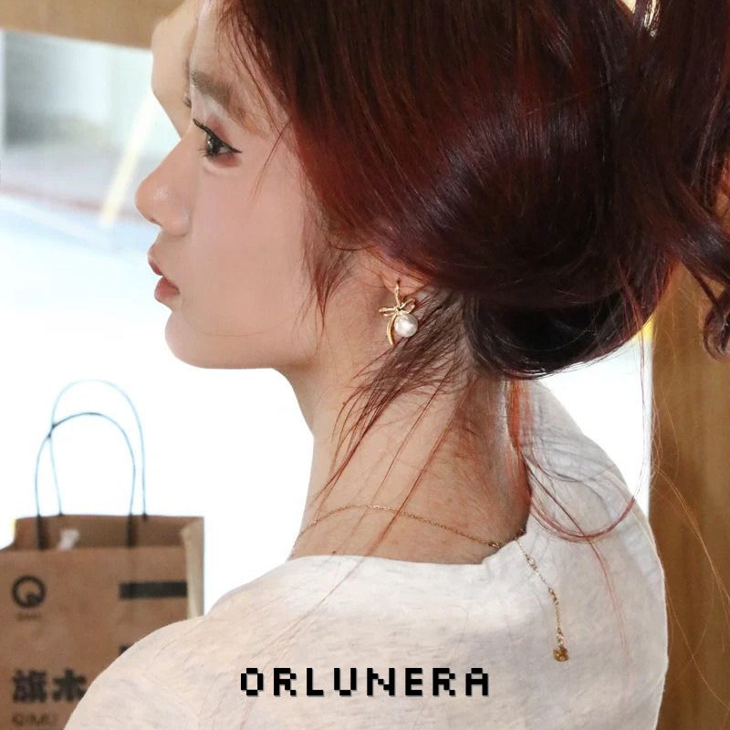 Lumière Bow Butterfly Pearl Clip-On Earrings — Edition 50 product image
