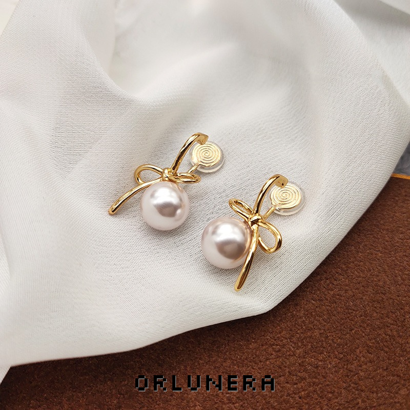 Lumière Bow Butterfly Pearl Clip-On Earrings — Edition 50 product image