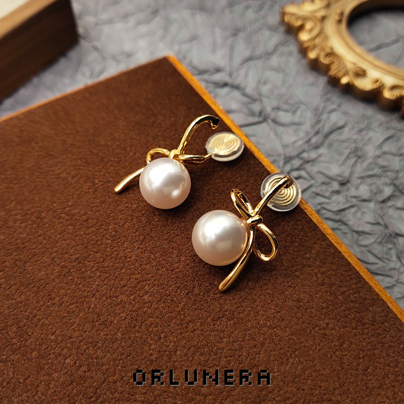 Lumière Bow Butterfly Pearl Clip-On Earrings — Edition 50 product image