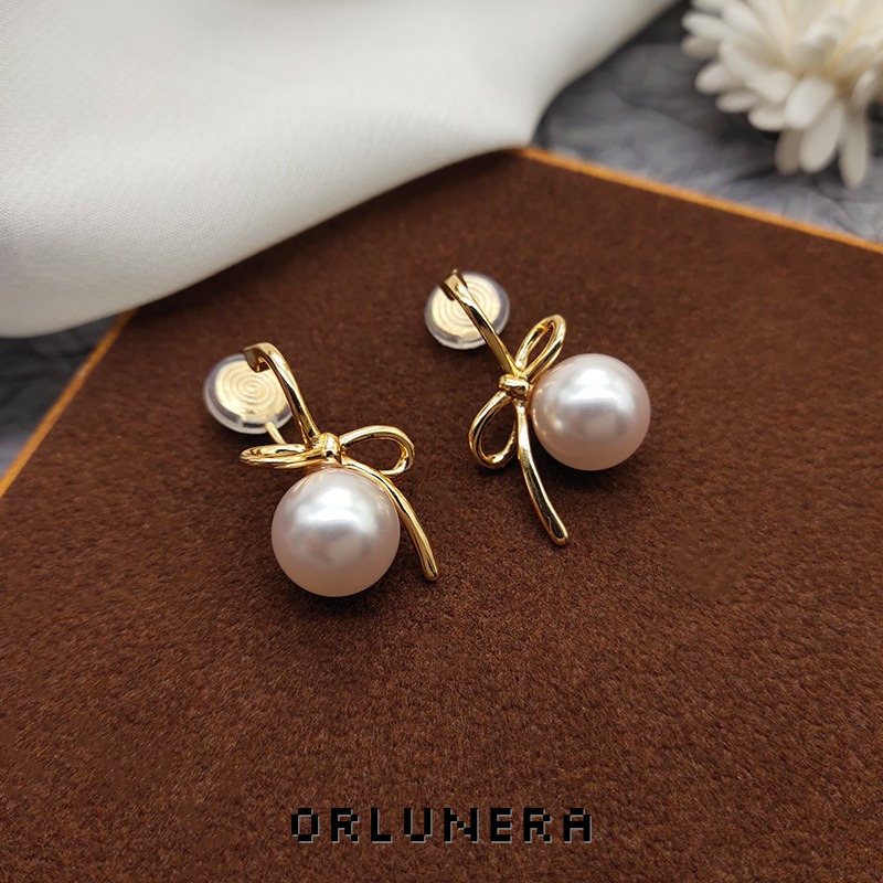 Lumière Bow Butterfly Pearl Clip-On Earrings — Edition 50 product image