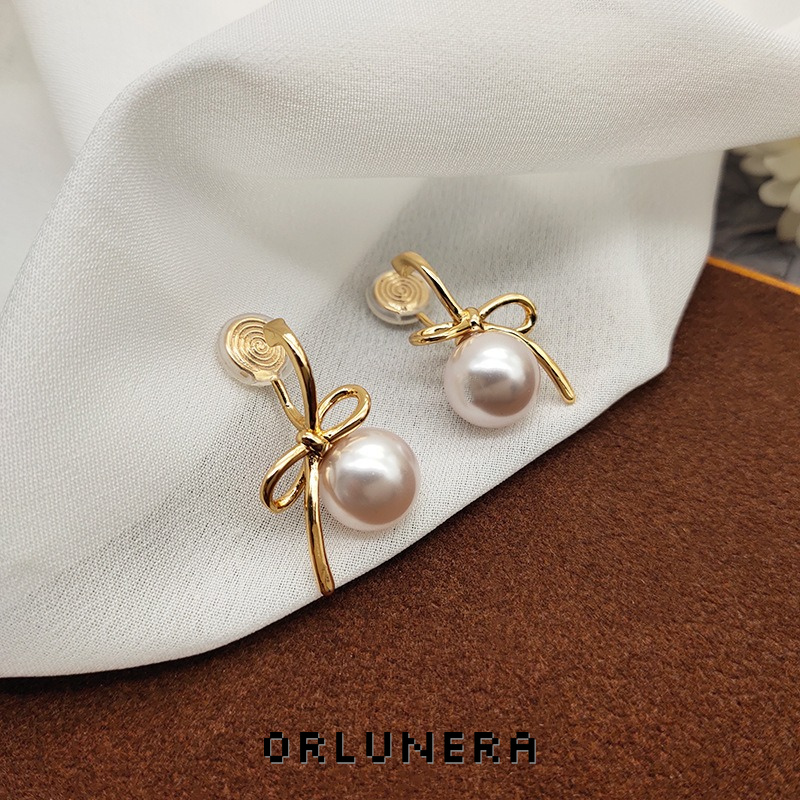 Lumière Bow Butterfly Pearl Clip-On Earrings — Edition 50 product image