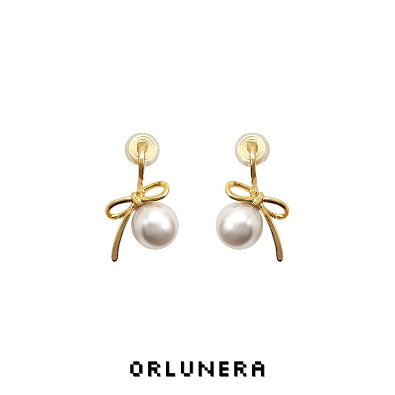 Lumière Bow Butterfly Pearl Clip-On Earrings — Edition 50 product image