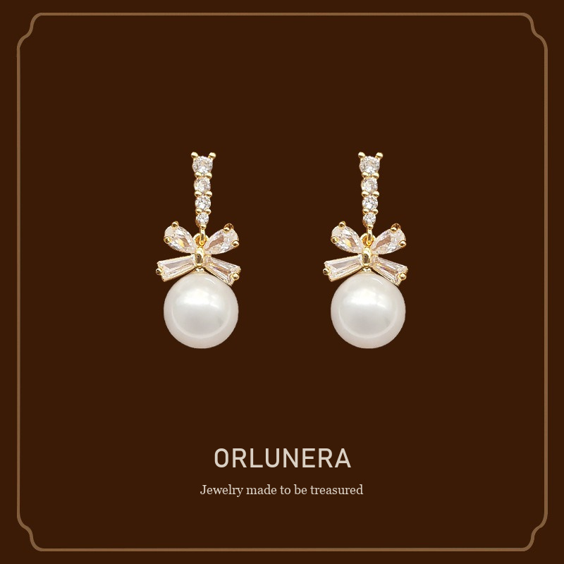 Noelle Bow Butterfly Pearl Clip-On Drop Earrings Orlunera cover