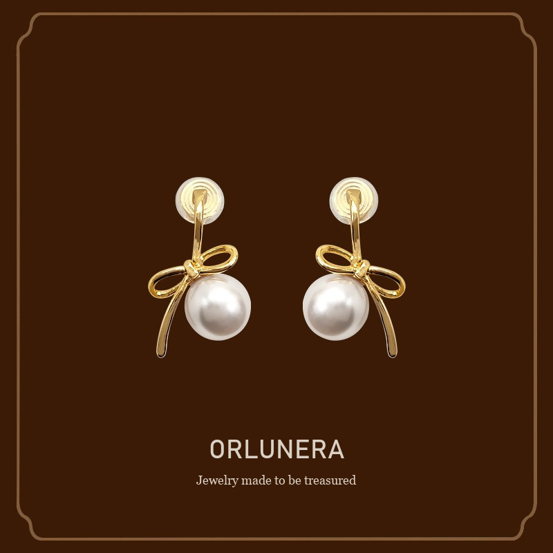 Lumière Bow Butterfly Pearl Clip-On Earrings — Edition 50 Orlunera cover