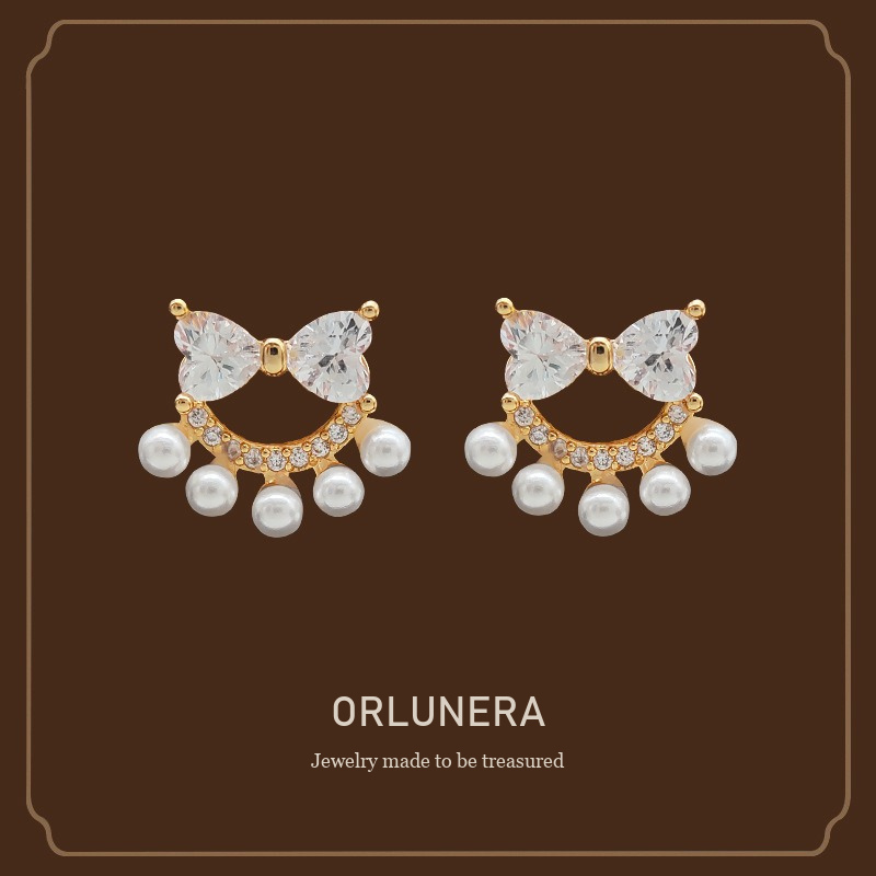 Lumière Bow Butterfly Pearl Clip-On Earrings — Edition 74 Orlunera cover